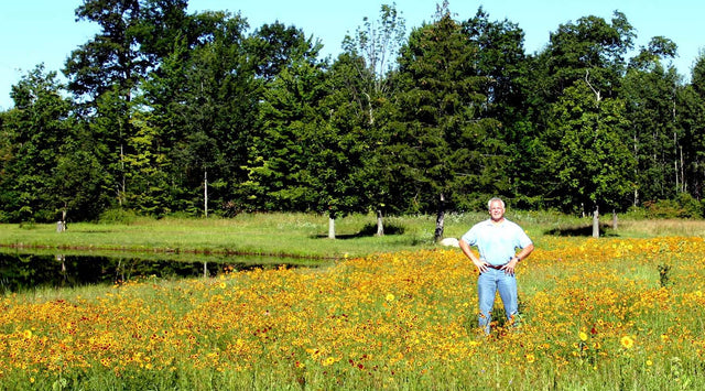 Tom Jones in a field of wildflowers