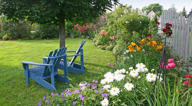 Lawn chairs and a garden border.